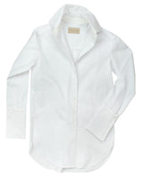 The perfect white shirt. Classic Six Donna White shirt. Season-less, crisp cotton button-down blouse with extra-long cuff, side slits, French seams, grosgrain detailing, and uniquely positioned pearl shell buttons for ideal fit.