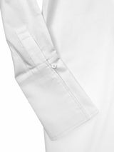 The perfect white shirt. Classic Six Donna White shirt. Season-less, crisp cotton button-down blouse with extra-long cuff, side slits, French seams, grosgrain detailing, and uniquely positioned pearl buttons for ideal fit.